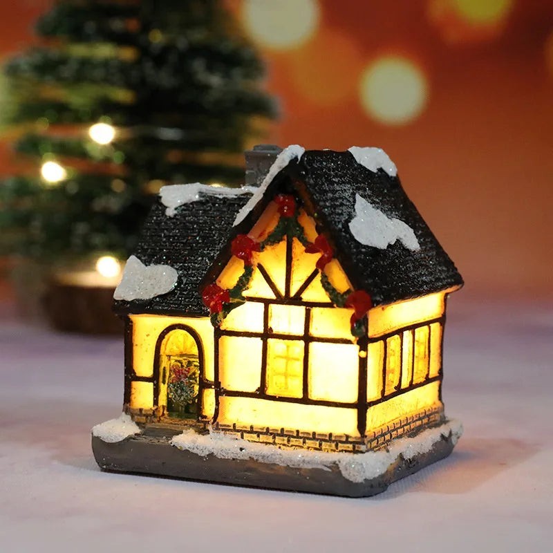 Decorative lit house with a snowy roof, surrounded by a festive background.